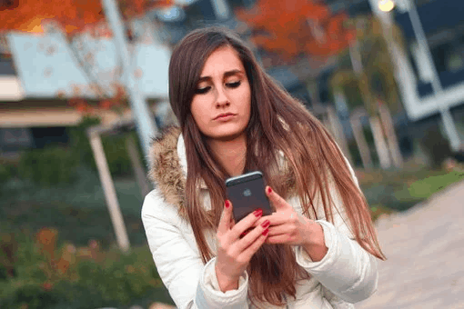 Woman operating smartphone